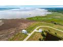 Waterfront property with well-maintained landscaping and a private drive at 1716 Cravens St., Georgetown, SC 29440