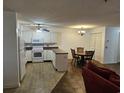 Efficient kitchen with white appliances, and a dining area perfect for casual meals and entertaining at 197 Charter Dr. # D1, Longs, SC 29568