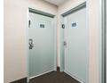 Condo hallway with two light blue doors, each with a room number plaque at 201 74Th Ave. N # 2243/2244, Myrtle Beach, SC 29572