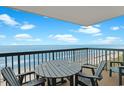 Relaxing balcony seating area features ocean views and cool breezes at 201 S Ocean Blvd. # 1106, North Myrtle Beach, SC 29582