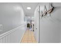 Hallway with decorative accents and nautical-themed decor leading to the main living space at 202 North Ocean Blvd. # 109, North Myrtle Beach, SC 29582