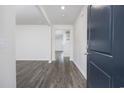 Welcoming entryway with durable floors leading to an open floorplan and staircase at 3573 Bells Lake Circle, Longs, SC 29568