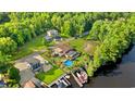 Aerial view showcases a charming property with a pool, boat dock, and lush greenery at 3721 Ed Smith Ave., Myrtle Beach, SC 29588