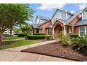 Exterior of two-story townhomes, showcasing well-maintained landscaping and inviting curb appeal at 4505 Lightkeepers Way # 24B, Little River, SC 29566