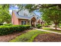 Charming townhomes featuring manicured lawns and sidewalks that add to the neighborhood's curb appeal at 4505 Lightkeepers Way # 24B, Little River, SC 29566