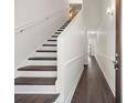 Inviting foyer with modern staircase and beautiful wood-look flooring at 4510 Little River Inn Dr. # 2708, Little River, SC 29566