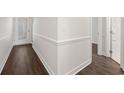 Bright hallway featuring elegant trim work and durable wood-look floors at 4510 Little River Inn Dr. # 2708, Little River, SC 29566