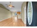Inviting entryway boasts hardwood floors, and a view of the bright kitchen and dining area at 520 Winged Elm St., Loris, SC 29569