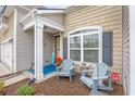 Inviting front porch with rocking chairs, perfect for relaxing outdoors at 5475 Elba Way # 1601, Myrtle Beach, SC 29579