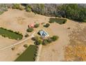Expansive aerial view showcasing a property with lush ponds, outbuildings, and beautiful landscaping at 589 Loop Circle, Longs, SC 29568