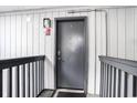 Apartment entry door with wood paneling and storm door mat at 6000 N Ocean Blvd. # 329, North Myrtle Beach, SC 29582