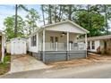 Inviting home with a quaint porch and convenient storage shed at 6001 - 1498 S Kings Hwy., Myrtle Beach, SC 29575