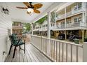 Relaxing porch view with seating and a ceiling fan for comfort at 6001 - 1498 S Kings Hwy., Myrtle Beach, SC 29575