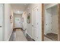 Welcoming entryway with neutral walls, wood floors and decor that creates a warm atmosphere at 877 Farmers Passage Loop, Loris, SC 29569