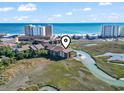Scenic aerial view showcasing condo's proximity to beaches and ocean, with marshland surrounding the building at 9501 Shore Dr. # A-311, Myrtle Beach, SC 29572