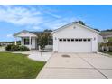 Two-car garage with paneled door and concrete driveway for parking convenience at 1001 Greencrest Ct., Conway, SC 29526