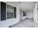 Covered front porch with ceiling fans and views of the front yard at 1001 Greencrest Ct., Conway, SC 29526