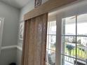 Balcony view of the neighborhood with an elegant beige curtain at 1029 Ray Costin Way # Villa 909, Murrells Inlet, SC 29576
