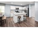 Bright kitchen featuring white cabinets, stainless steel appliances, and a center island with bar seating at 1143 Oak Meadow Dr., Conway, SC 29526