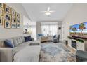 Comfortable living room with large sectional, television, and open access to the kitchen area at 135 Maggie Way, Myrtle Beach, SC 29588