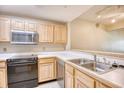Kitchen featuring stainless steel appliances, light wood cabinets and white countertops at 1550 Spinnaker Dr. # 3123, North Myrtle Beach, SC 29582