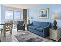 Cozy living room with ocean view, comfortable seating, and a dining area at 1708 N Ocean Blvd. # 101, Myrtle Beach, SC 29577