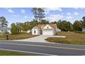 Inviting single-Gathering home featuring a well-manicured lawn and an attached garage at 1727 Cane Branch Rd., Loris, SC 29569