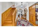 Grand foyer showcasing hardwood floors, an elegant staircase, and decorative accents at 1961 Bright Rd., Little River, SC 29566