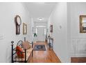 Inviting foyer with hardwood floors, decorative accents, and ample natural light at 2636 Brick Dr., Longs, SC 29568