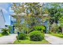 Beautiful two-story home with double decks, lush landscaping, and a driveway at 3659 Jordan Landing Rd., Murrells Inlet, SC 29576