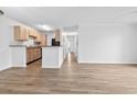 Bright living space with wood-look flooring and neutral paint, seamlessly connected to the kitchen at 3762 Citation Way # 1023, Myrtle Beach, SC 29577