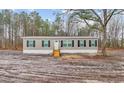 Exterior of a charming single story home with wooden porch and dark shutters at 3768 Green Sea Rd., Green Sea, SC 29545