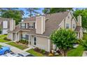 Two-story townhouse showcasing its manicured landscaping and inviting entrance, complete with well-maintained grounds at 503 20Th Ave. N # 55B, North Myrtle Beach, SC 29582