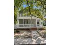 Charming gray two-story home with double porches and brick-lined entry at 505 Beaty St., Conway, SC 29526