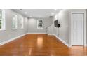 Bright living room with hardwood floors and natural light from the windows at 505 Beaty St., Conway, SC 29526
