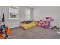 Comfortable bedroom features large windows offering great natural light at 553 Pier Ct., Longs, SC 29568