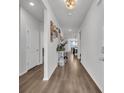 Inviting hallway features lovely decor, beautiful floors, and light neutral paint at 553 Pier Ct., Longs, SC 29568