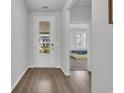 Hallway view to bedroom features white door and lovely neutral paint at 553 Pier Ct., Longs, SC 29568