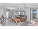 Cozy living room featuring a sofa, dining table, and a scenic view at 5905 S Kings Hwy. # 1816 Rt, Myrtle Beach, SC 29575