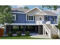 Lovely blue house with white trim, stairs, and carport offers great curb appeal at 8204 S Highway 905, Longs, SC 29568