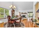 Elegant dining room with a chandelier, hardwood floors, and views into the living room at 103 Robin Ct., Murrells Inlet, SC 29576