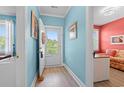Bright foyer with beachy blue walls and wood-look floors at 131 Waypoint Ridge Ave. # Q26, Little River, SC 29566