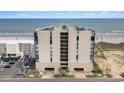 Aerial view of the condo building with beach access, parking, and clear ocean view at 1425 S Ocean Blvd. # 2A, North Myrtle Beach, SC 29582