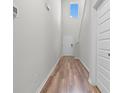 Bright hallway features soaring ceilings, wood-look floors, and a large window for natural light at 1560 Swing Bridge Way, Myrtle Beach, SC 29588