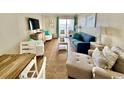 Inviting living room featuring ocean view, comfortable seating, and modern décor at 2001 S Ocean Blvd. # 303, Myrtle Beach, SC 29577