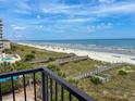 Beautiful beach and boardwalk views, and a partial view of a pool and other balconies at 2101 S Ocean Blvd. # A-4, North Myrtle Beach, SC 29582