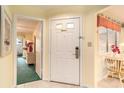 Inviting entrance with a white door, tiled floor, and a view into the living space at 213 Westleton Dr. # 16B, Myrtle Beach, SC 29572
