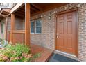 Charming front porch with brick accents, decorative trim, and a well-maintained exterior at 218 Waccamaw Village Dr. # 218, Myrtle Beach, SC 29579
