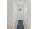 Bright entryway featuring white walls, wood-look floors, and a white door with a glass insert at 238 Christiana Ln. # C, Myrtle Beach, SC 29579