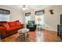 Comfortable living room with hardwood floors, ample seating, and natural light at 263 Walden Lake Rd., Conway, SC 29526
